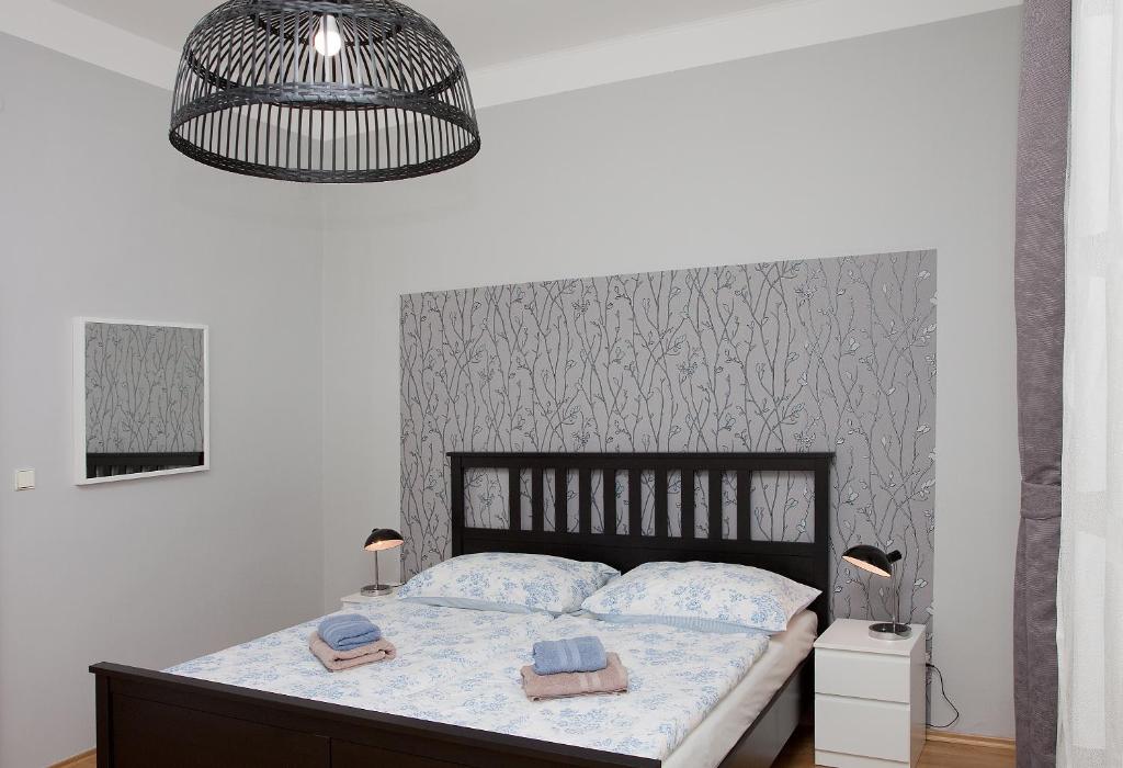 Postel nebo postele na pokoji v ubytování Hotel Richmond Teplice