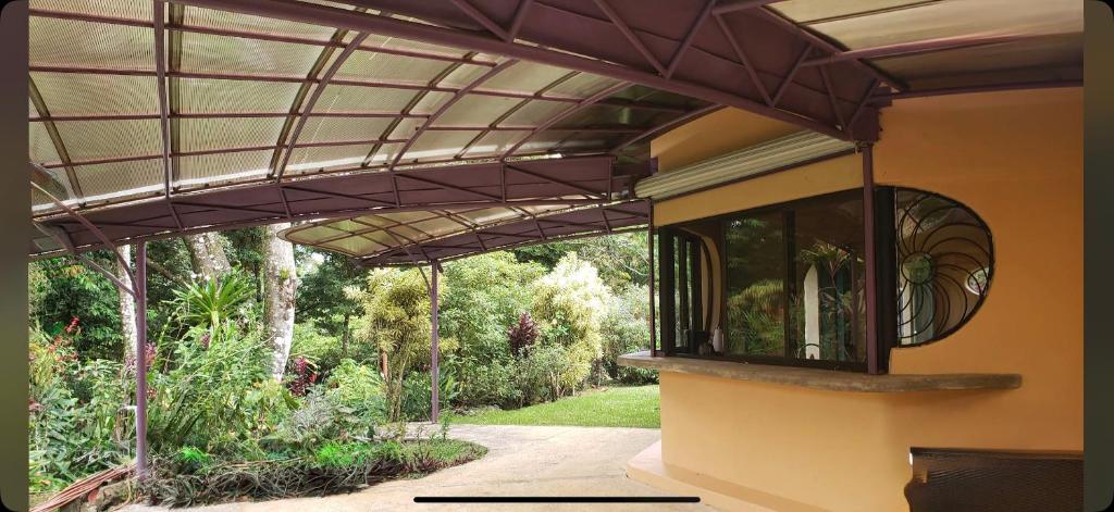 a pergola over a porch of a house at LaCusuca in Guadalajara