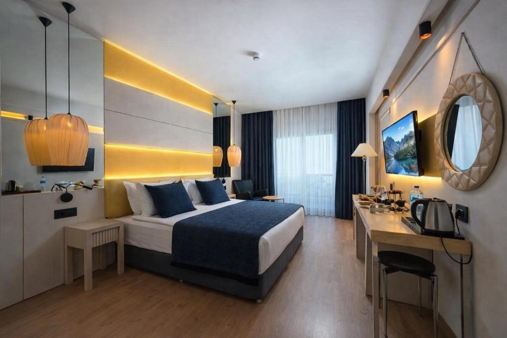 Postel nebo postele na pokoji v ubytování Khatai Aura Hotel