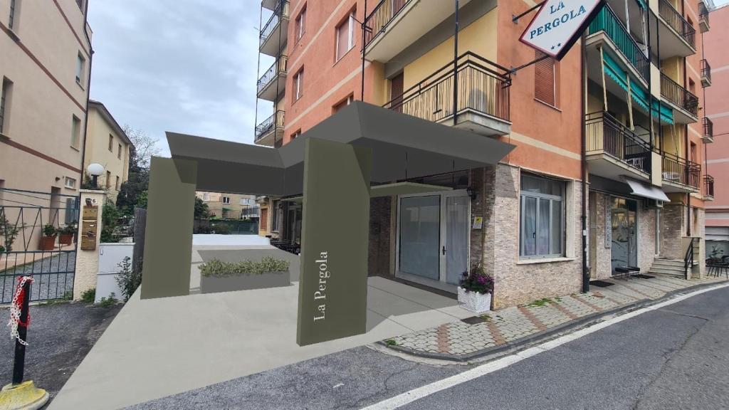 un edificio con un grande cartello sul lato di Hotel La Pergola a Loano