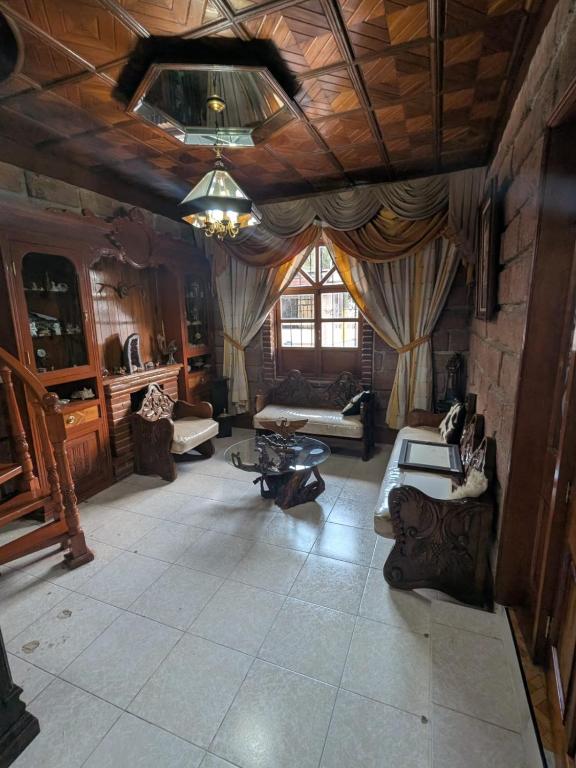 a living room with a couch and a table at Casa Quijote in Chiautla