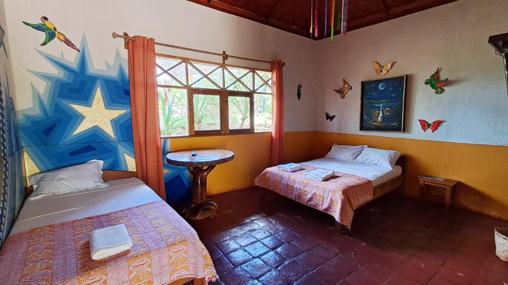 Giường trong phòng chung tại El Dulce Reposo