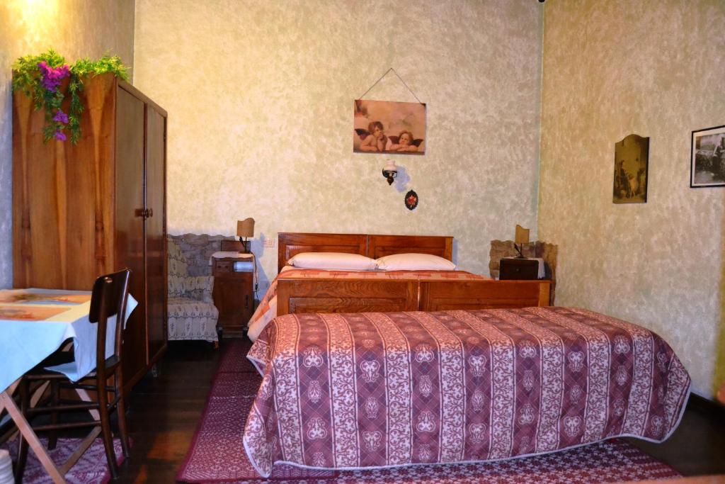 Postel nebo postele na pokoji v ubytování Chalet Su Foxile