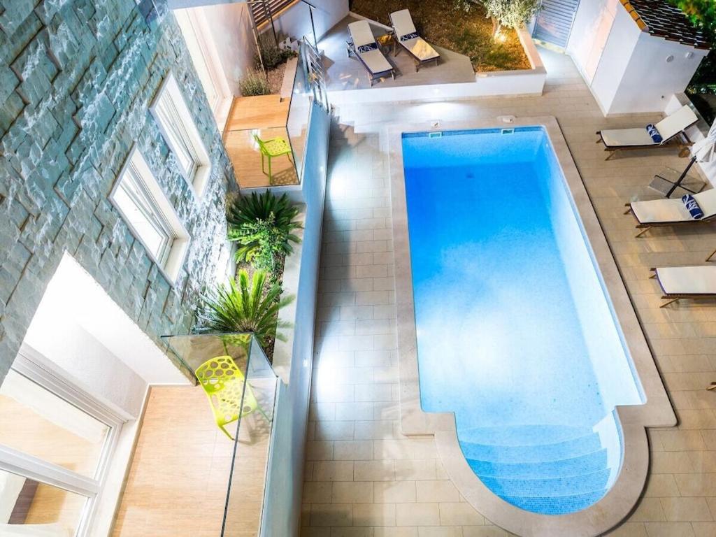 an overhead view of a swimming pool in a building at Villa in Bol with swimming pool in Bol