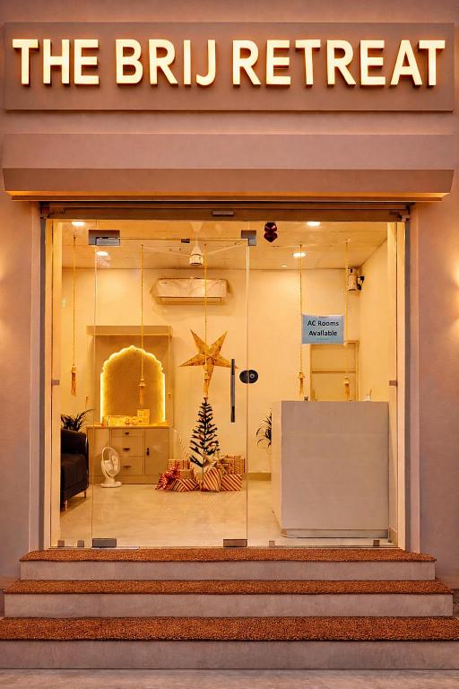 a store window with a sign for the britt retreat at The Brij Retreat , 50 mtr from Shri Krishna Janambhumi in Mathura