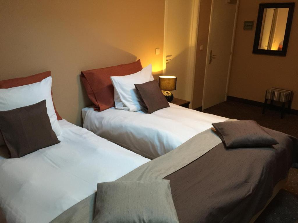 Postel nebo postele na pokoji v ubytování Hotel Malon