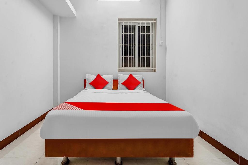 En eller flere senge i et værelse på Hotel O Crown Tower