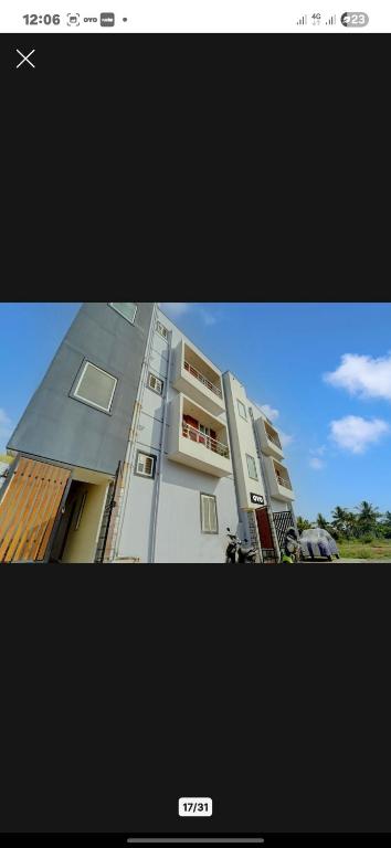 a picture of a building with a picture of it at Mm Home Stay in Coimbatore