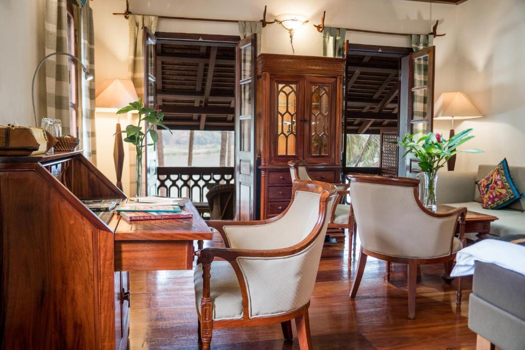 Fine Mai Dou wood accents and traditional Lao decorations inside the junior suite