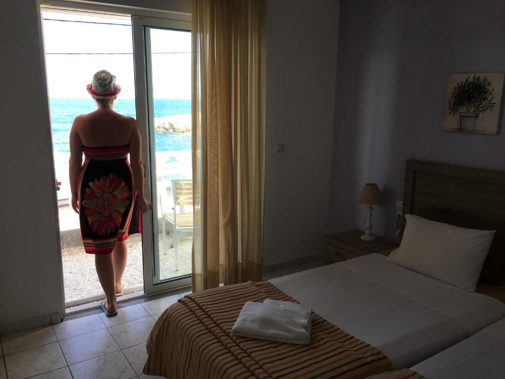 Postel nebo postele na pokoji v ubytování Zorbas Hotel