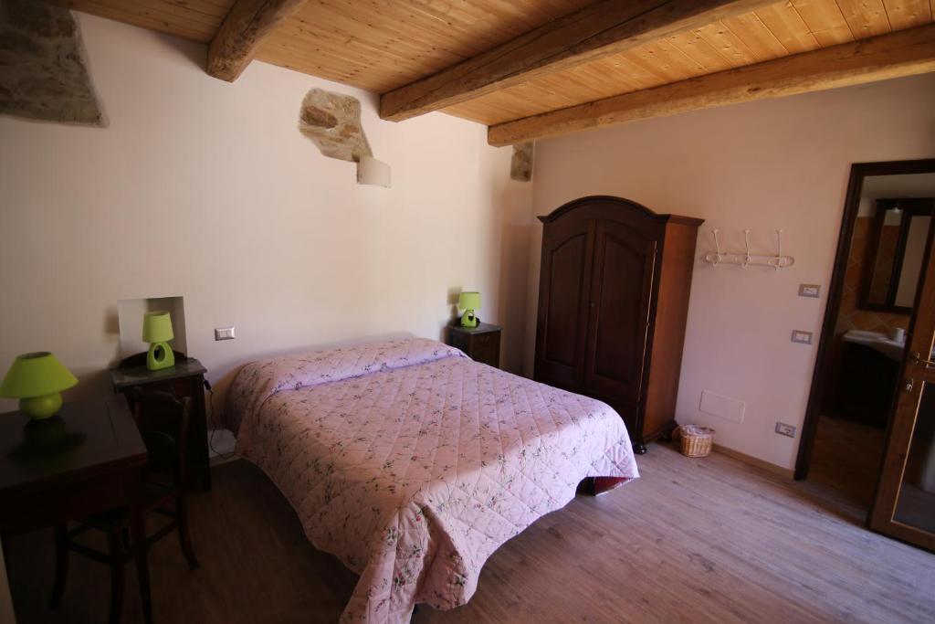 Postel nebo postele na pokoji v ubytování La Pepanella