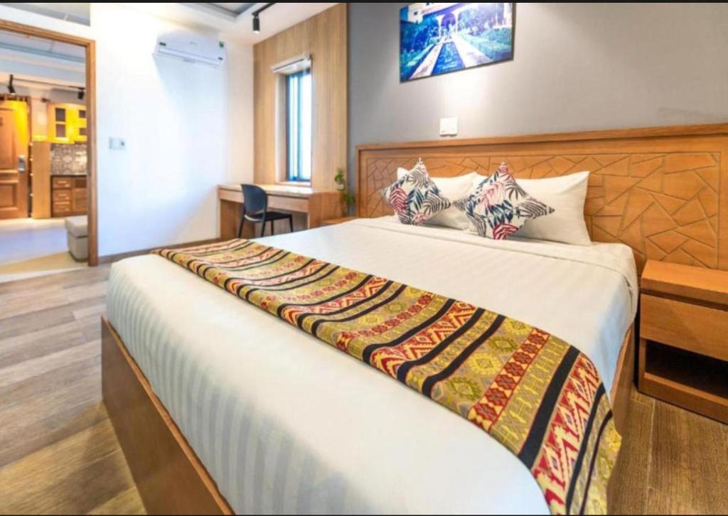 Ένα ή περισσότερα κρεβάτια σε δωμάτιο στο Paradise Indochine Hoi An