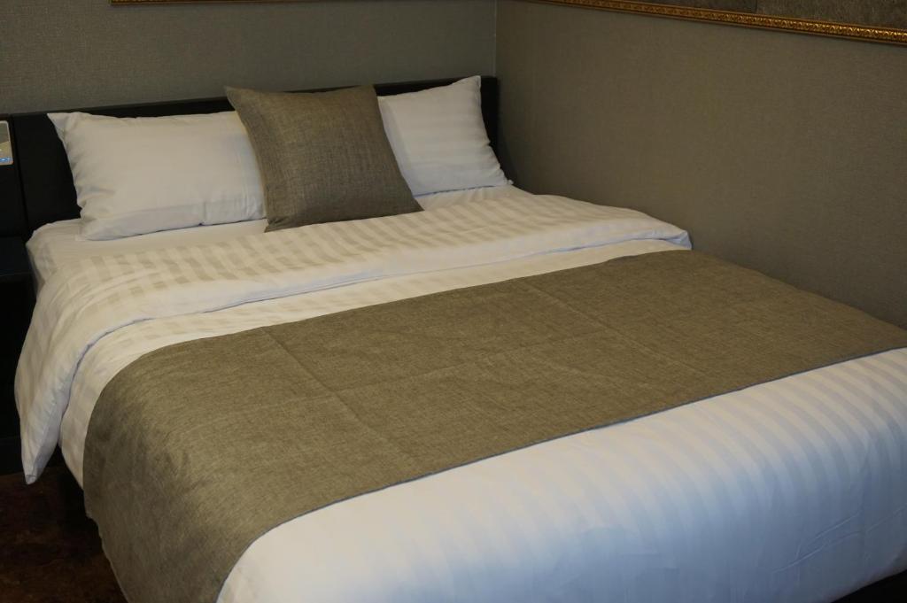 Postel nebo postele na pokoji v ubytování Major Hotel 2