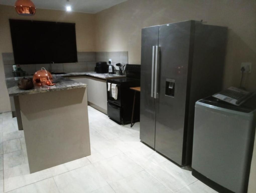 Køkken eller tekøkken på Infinity Guesthouse