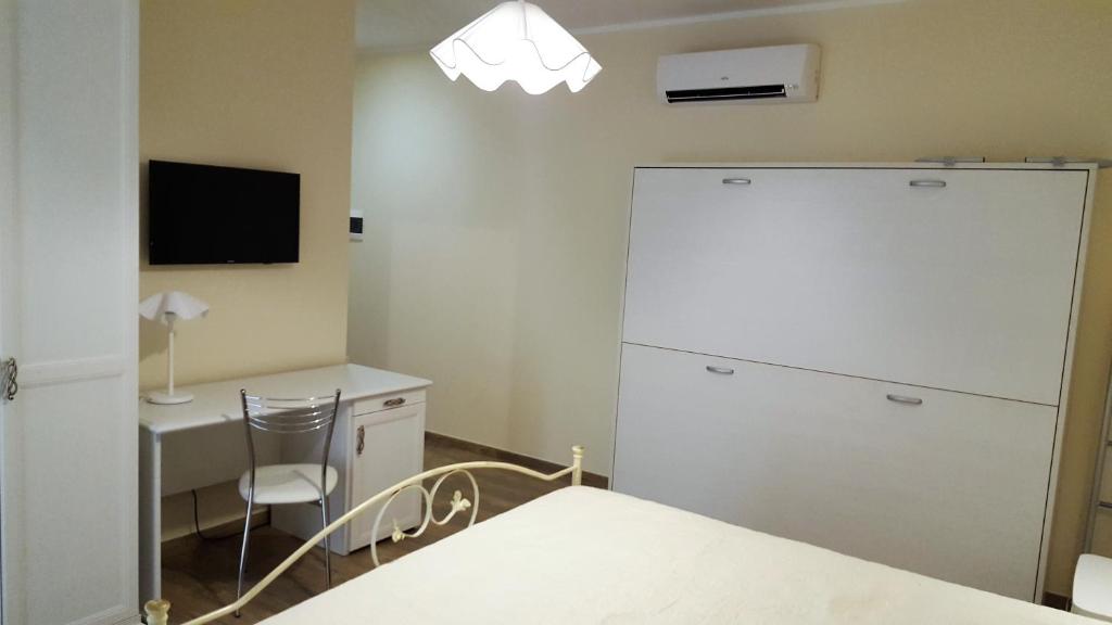 Telewizja i/lub zestaw kina domowego w obiekcie Bed and Breakfast Sun Wine