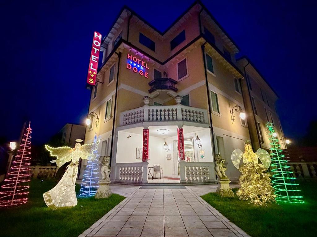 a building with christmas lights in front of it at Hotel Doge in Vicenza