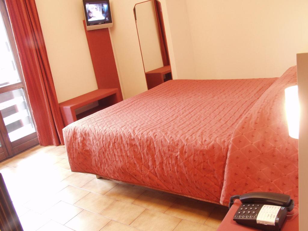 Postel nebo postele na pokoji v ubytování Euro Hotel