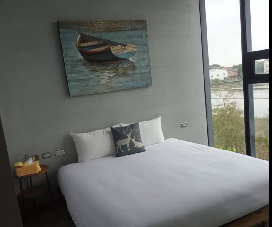 En eller flere senge i et værelse på 吳老闆民宿