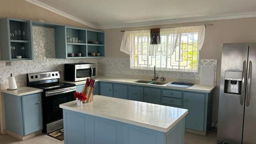 Køkken eller tekøkken på Hope Winds - by ZenBreak