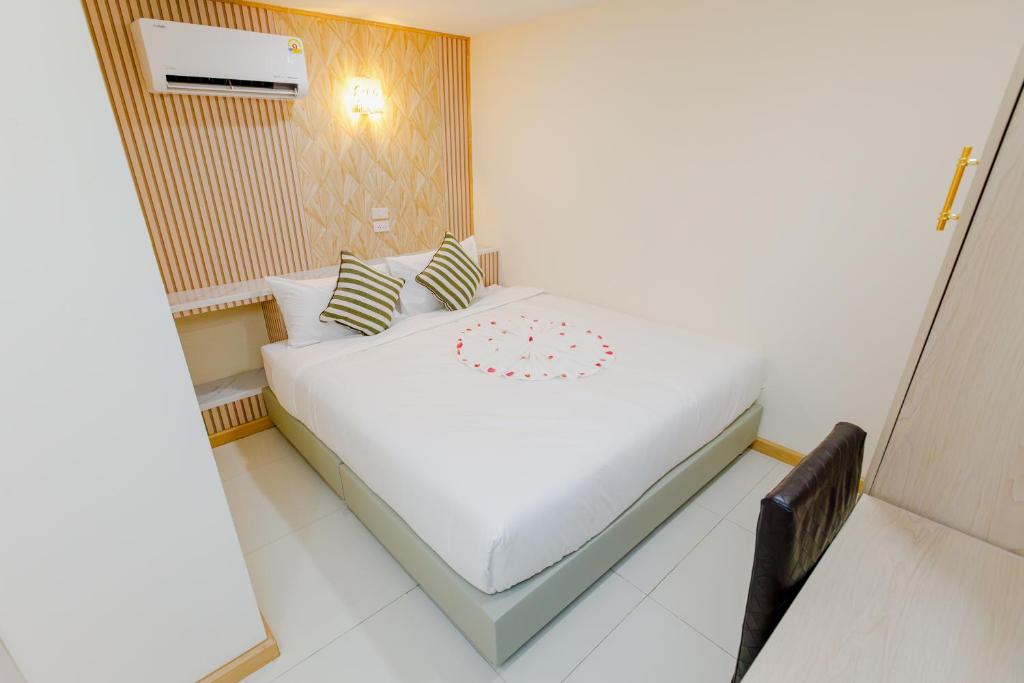 En eller flere senge i et værelse på PSA Palace Khaosan