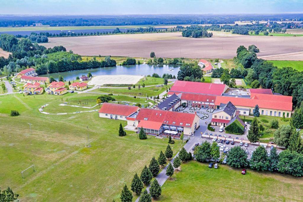 an aerial view of a large building with a river at Sport- & Vital-Resort Neuer Hennings Hof in Perleberg