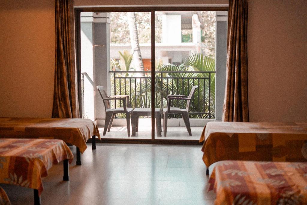 En eller flere senge i et værelse på The Rosewood by Advaya