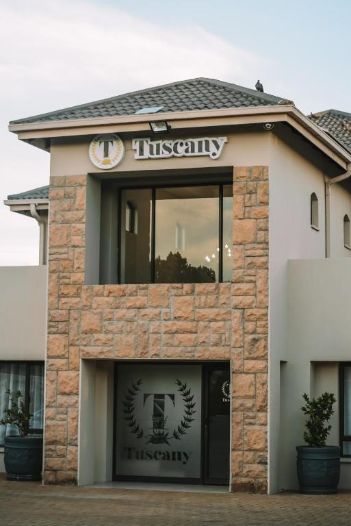 a building with a sign for a museum at Tuscany Vryburg in Vryburg