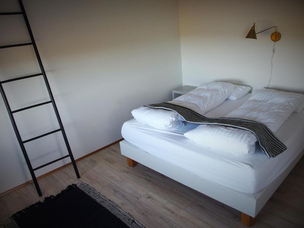 Postel nebo postele na pokoji v ubytování Saltvík Farm Guesthouse