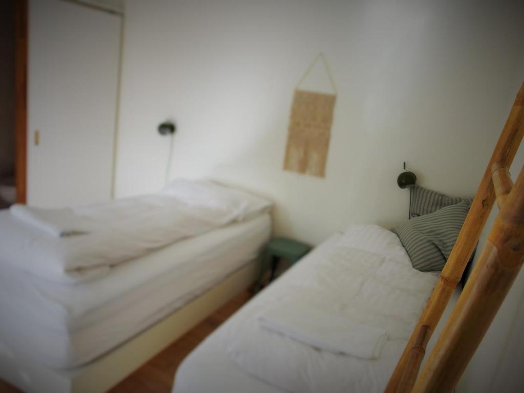 Postel nebo postele na pokoji v ubytování Saltvík Farm Guesthouse