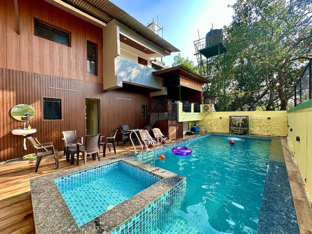 een zwembad voor een huis bij Heaven-The Mannat Sanctuary in Lonavala