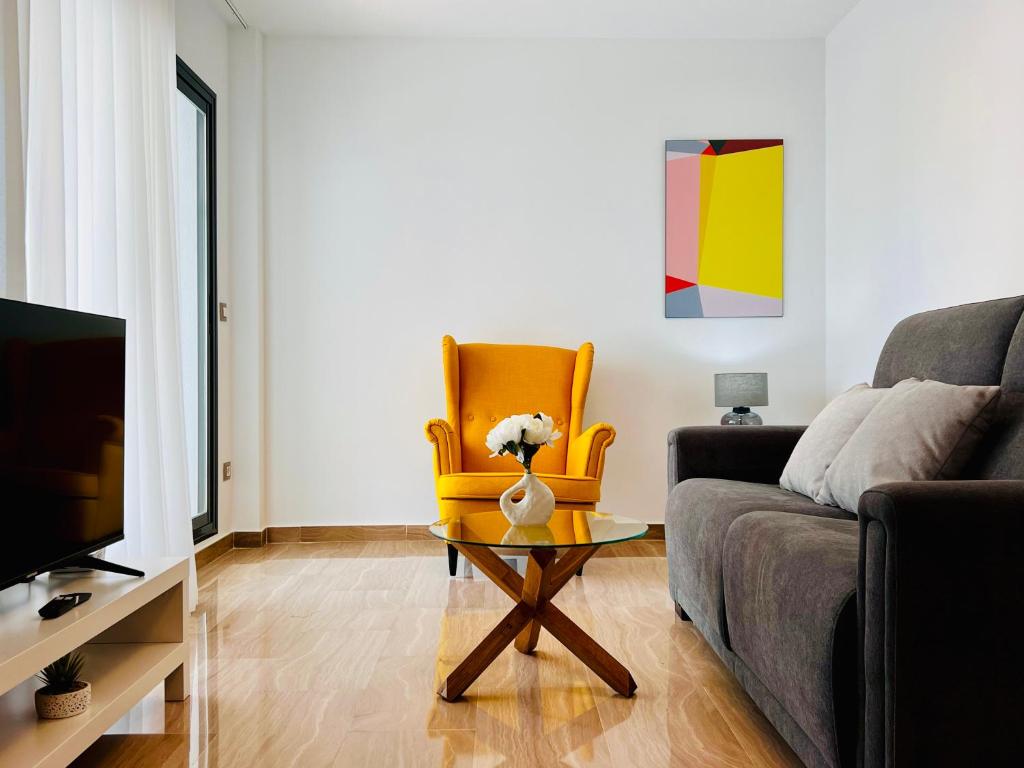 a living room with a couch and a table at Calamora I by Sun & Sea Homes in Moraira