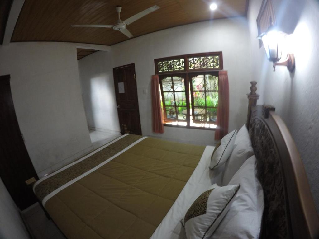 Postel nebo postele na pokoji v ubytování Eka's Homestay