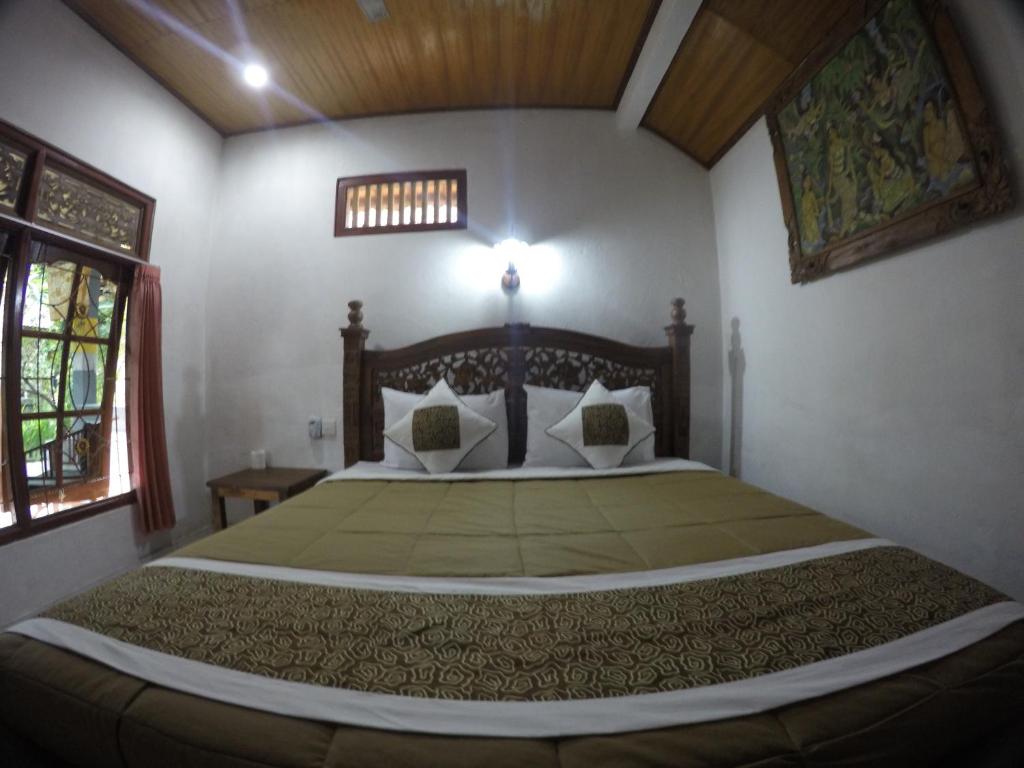 Postel nebo postele na pokoji v ubytování Eka's Homestay