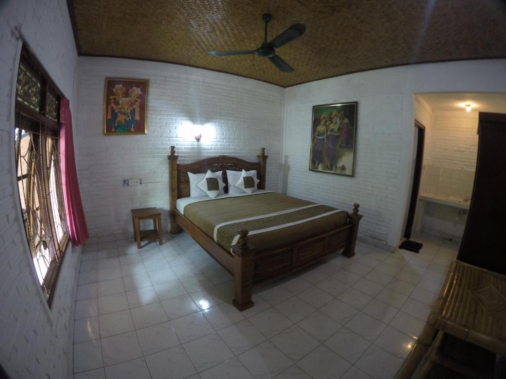 Postel nebo postele na pokoji v ubytování Eka's Homestay