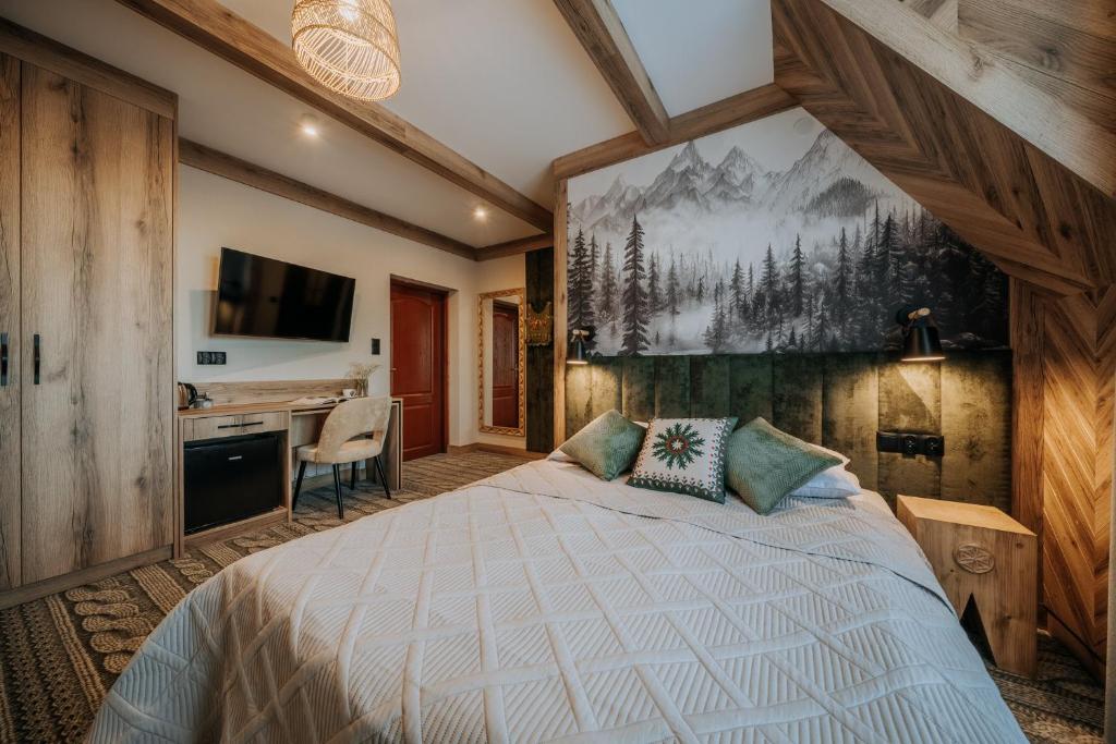 a bedroom with a bed and a desk at Pokoje Gościnne u Moniki Zakopane - 4 km do centrum in Zakopane