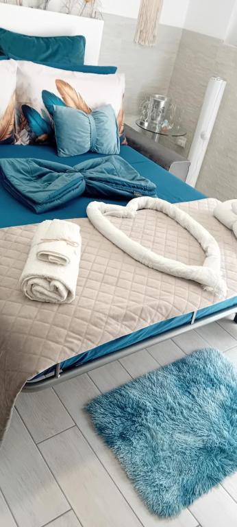 Postel nebo postele na pokoji v ubytování BOSCA SUITE