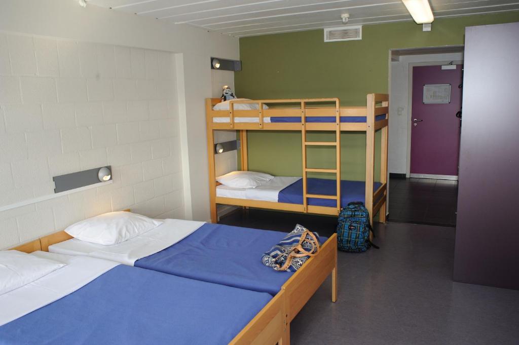 Postel nebo postele na pokoji v ubytování Hostel De Veurs