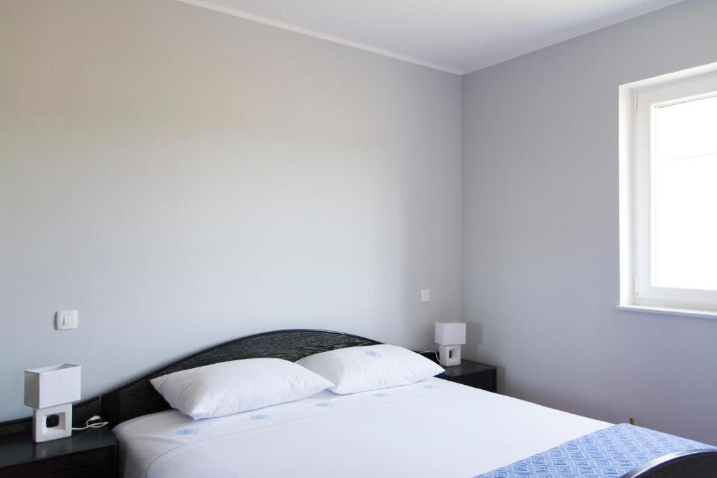 Posteľ alebo postele v izbe v ubytovaní Modrika Apartments