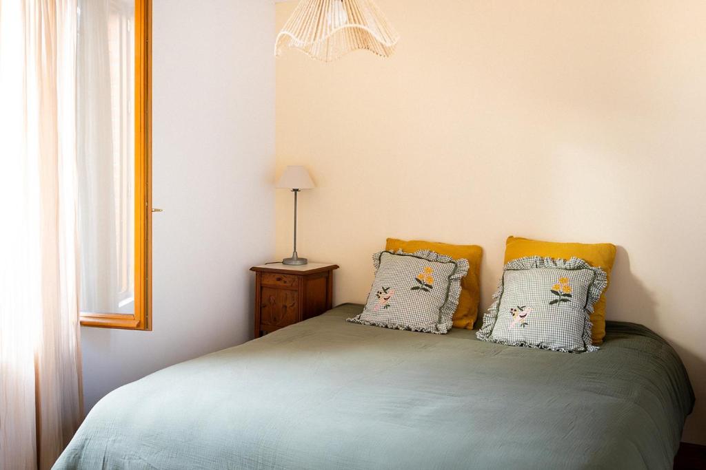 Letto o letti in una camera di L'Auberge des Clés