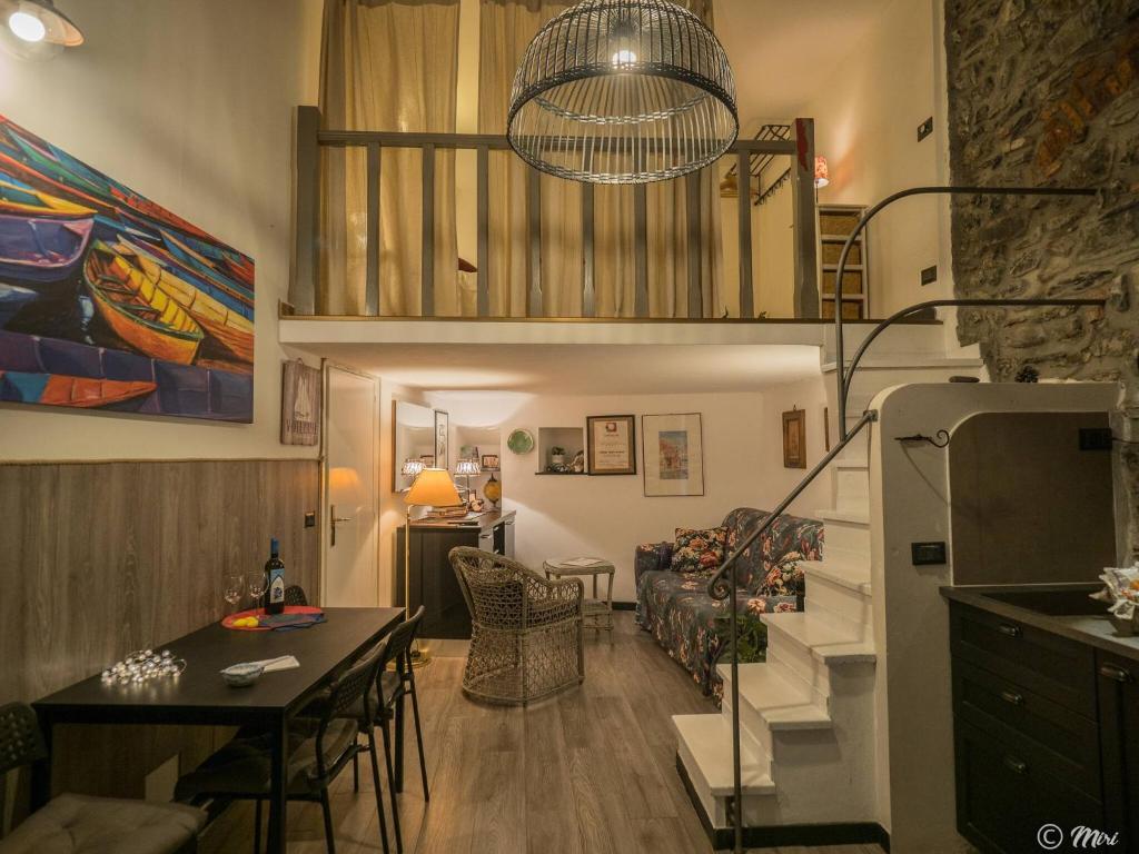 a small living room with a staircase and a living room at Petrella's Point Studio with AC in Vernazza