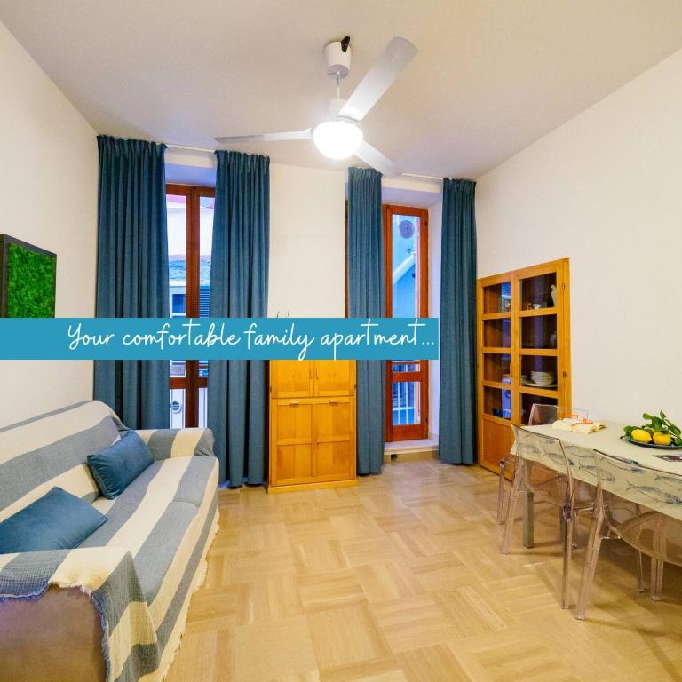 a living room with a couch and a table at Casa Pina Family Apartment in Vernazza