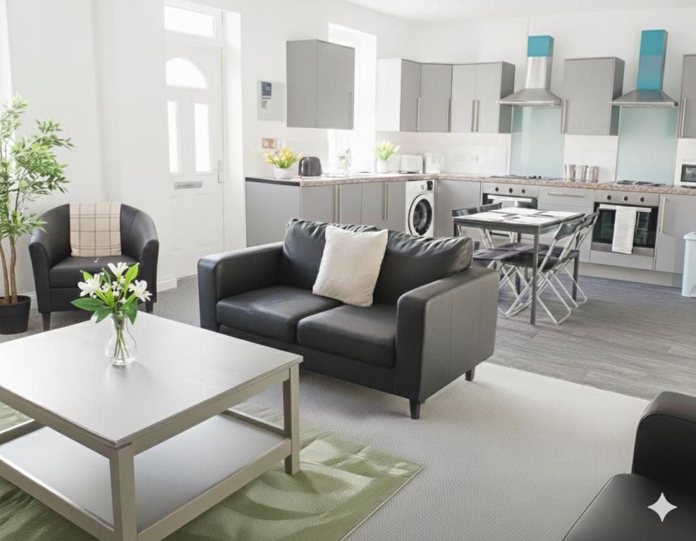 a living room with a couch and a table at Esk View House,Carlisle in Carlisle