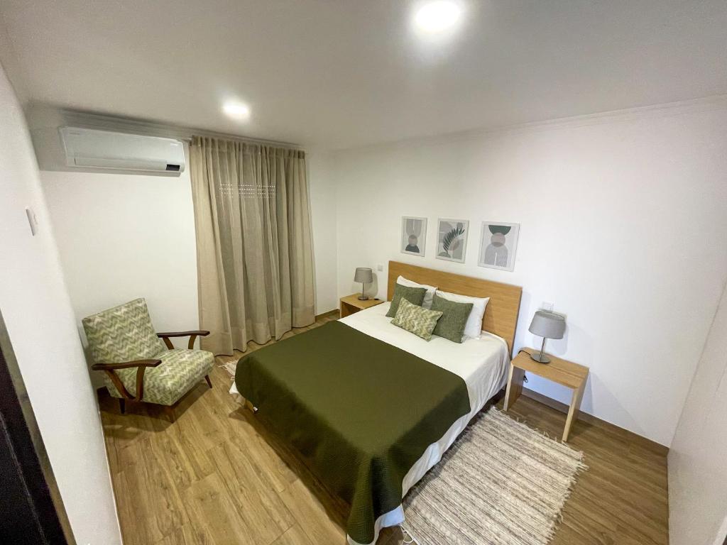 En eller flere senge i et værelse på Casa do Barbosa