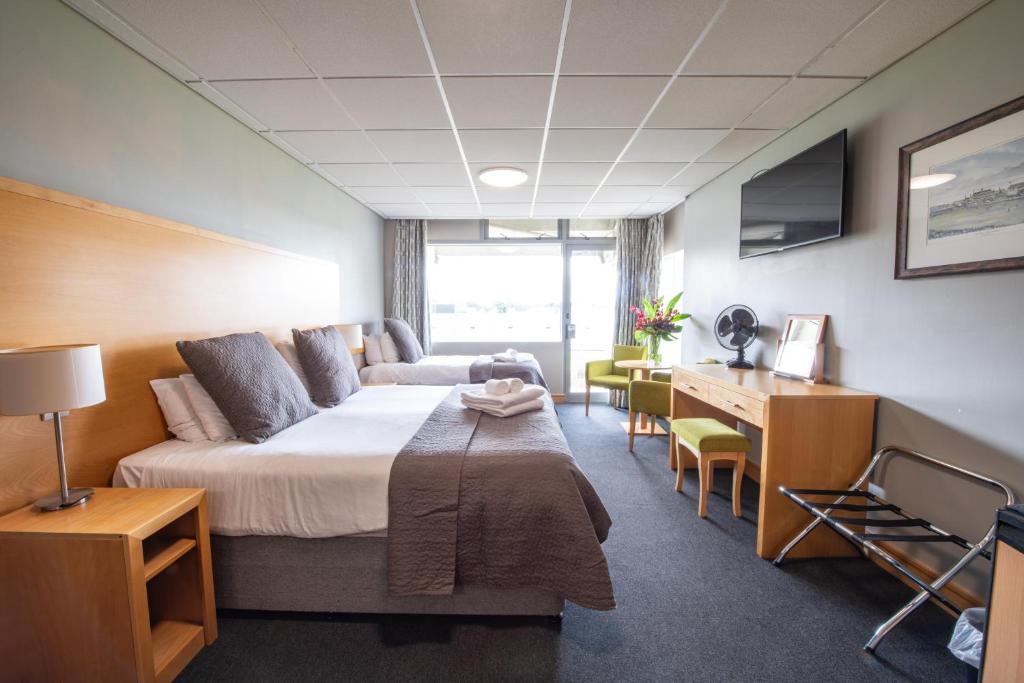 Ένα ή περισσότερα κρεβάτια σε δωμάτιο στο Headingley Stadium Hotel