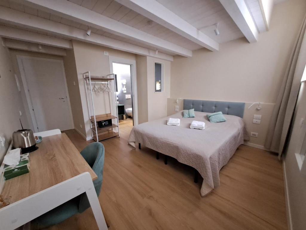 Postel nebo postele na pokoji v ubytování Photomusic Boutique Rooms