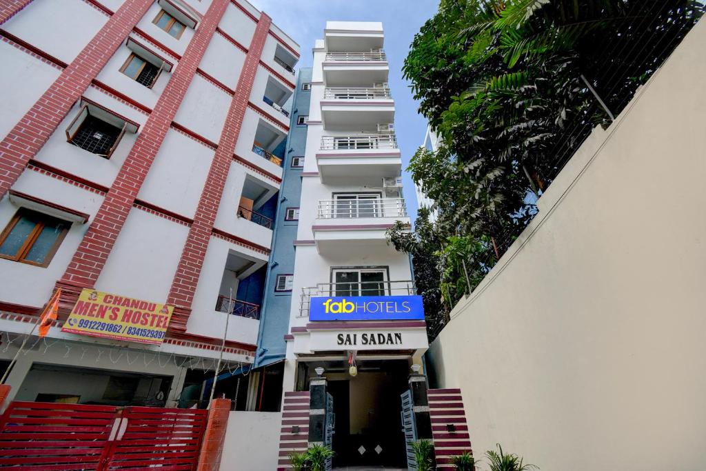 a building with a sign in front of it at FabHotel Heaven 75 in Hyderabad
