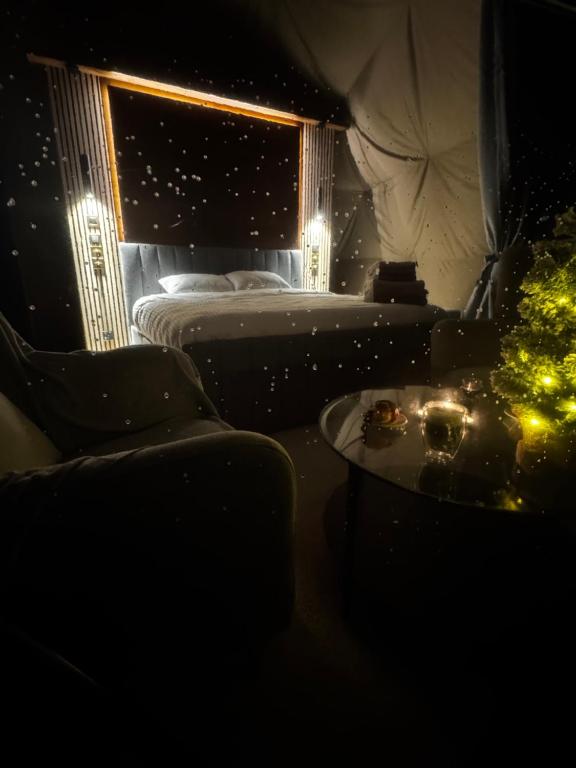 a bedroom with a bed and a christmas tree at Princess Milena in London