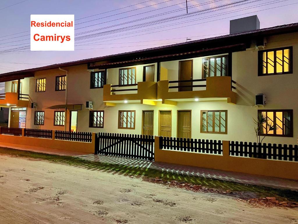 a large house with a street in front of it at Residencial Camirys in Itapoa