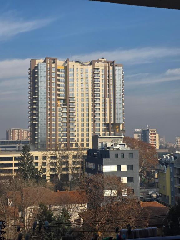 a group of tall buildings in a city at Lux Main Square in Skopje