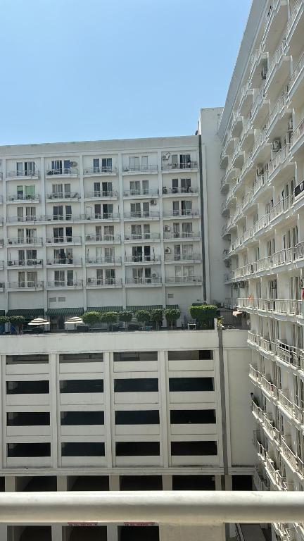 a view of two apartment buildings from a balcony at The Amerin Inn & Suites , Gomti Nagar Lucknow in Lucknow